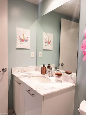Bathroom featuring vanity and toilet