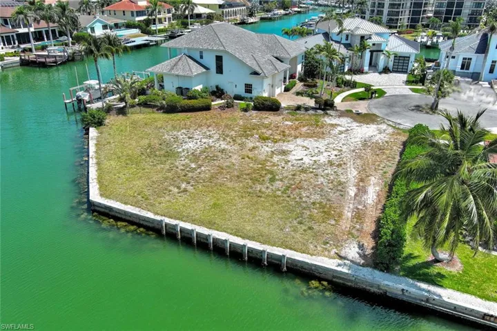 Drone / aerial view with a residential view and a water view