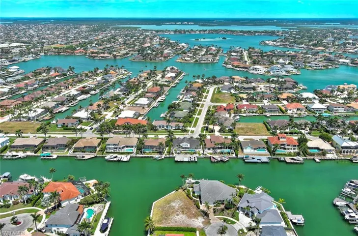 Aerial view featuring a water view and a residential view