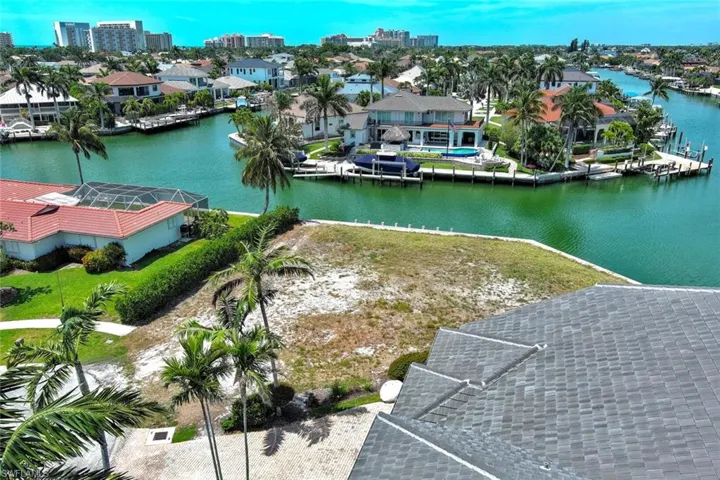 Birds eye view of property featuring a residential view and a water view