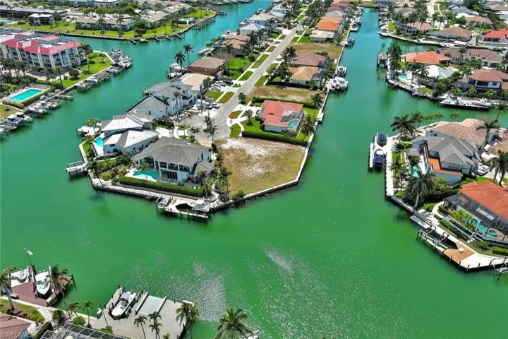 Aerial view featuring a water view and a residential view
