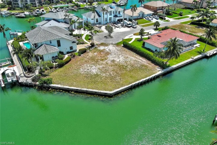 Birds eye view of property featuring a residential view and a water view