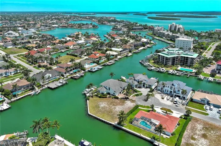 Aerial view featuring a residential view and a water view