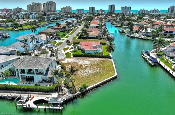 Drone / aerial view with a city view and a water view