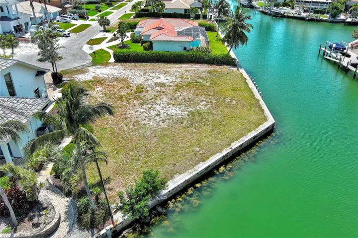 Birds eye view of property featuring a residential view and a water view