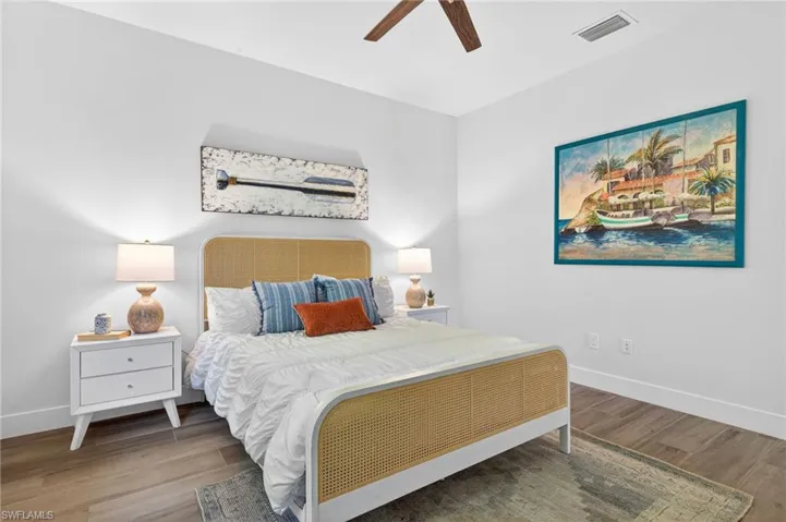 Bedroom featuring wood finished floors and ceiling fan