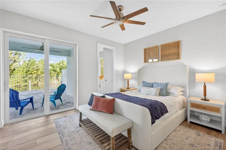 Bedroom featuring light wood-type flooring, ceiling fan, and access to exterior