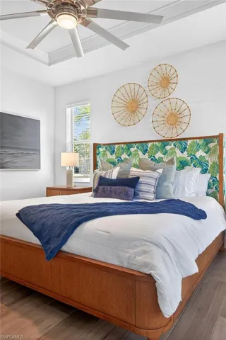 Bedroom featuring wood finished floors and a ceiling fan