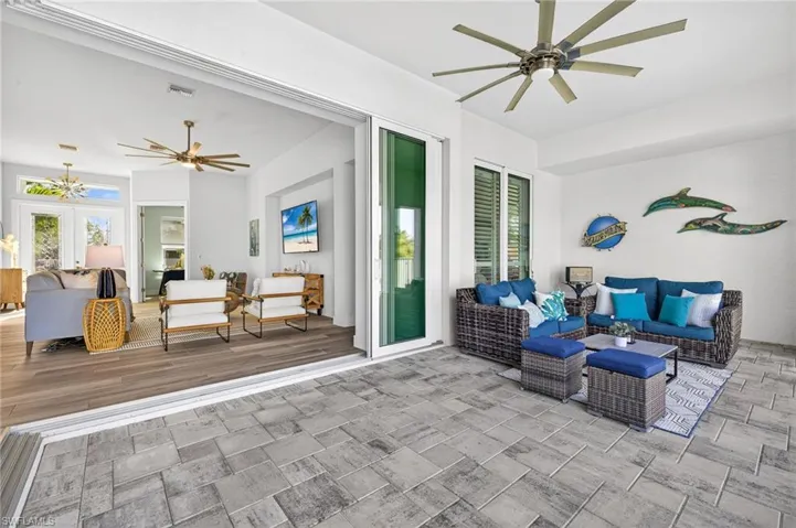 View of patio / terrace featuring ceiling fan, outdoor seating, and french doors