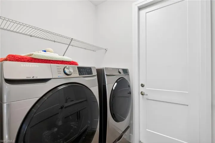 Laundry room featuring separate washer and dryer
