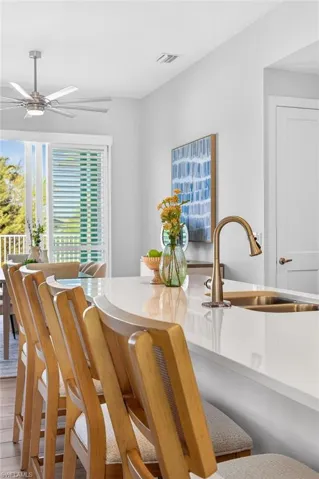 Dining area featuring a ceiling fan and wood finished floors