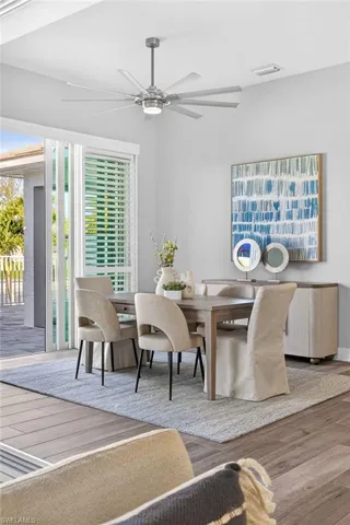Dining space featuring hardwood / wood-style floors and ceiling fan