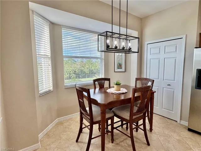 Dining area with a notable chandelier