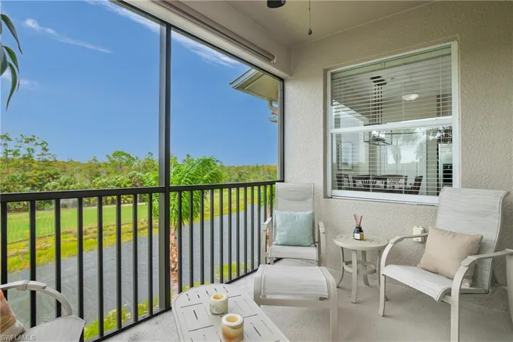 Screened lanai featuring a water view