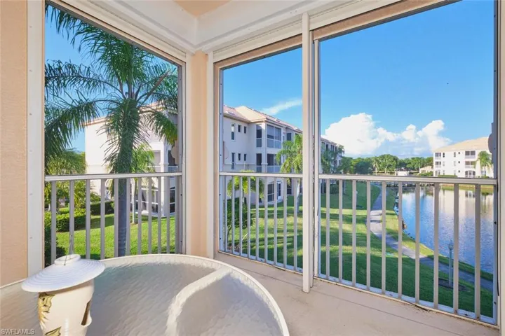 Unfurnished sunroom featuring a water view