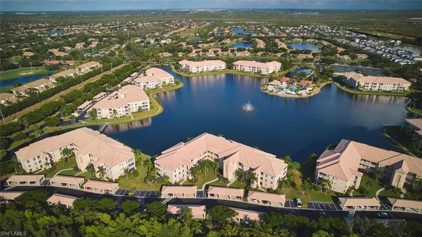 View of property location with a nearby body of water and nearby suburban area