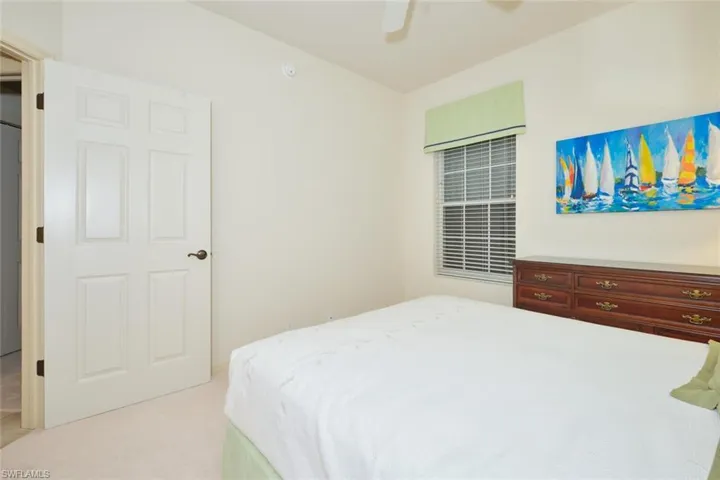 Bedroom with carpet and a ceiling fan