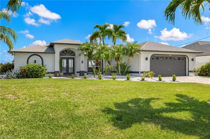 Front elevation with mature landscaping. Newly painted exterior with new exterior lighting.