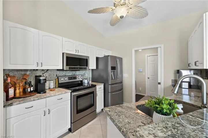 Kitchen featuring appliances with stainless steel finishes, tasteful backsplash, and access through the Laundry room to the garage.