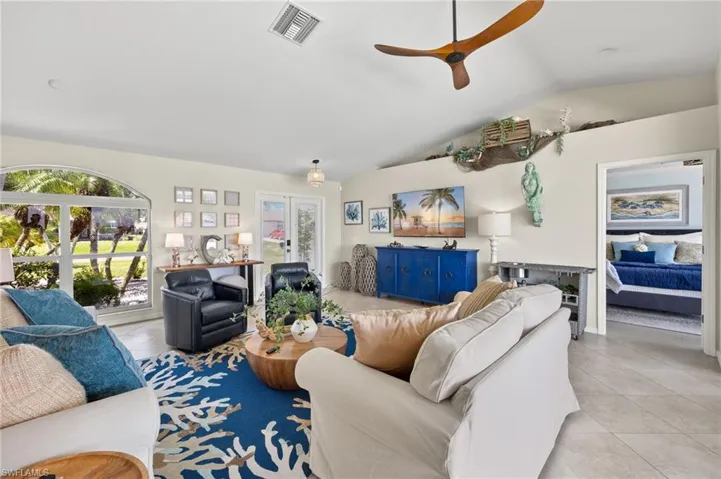 Entry into great room with vaulted ceilings and Diagonal tile floors.