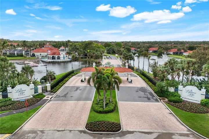 Birds eye view of property with a water view