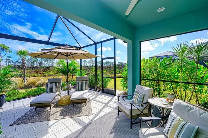 Screened Lanai featuring vaulted ceiling and ceiling fan