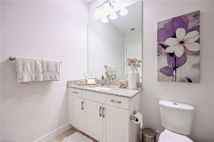 Guest Bathroom featuring vanity and toilet