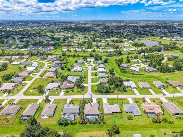 Aerial view of residential area with a large body of water