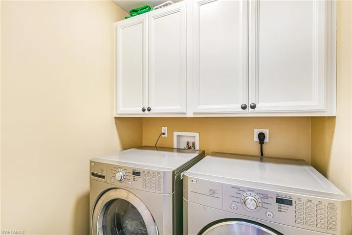 White shaker-style cabinetry with dark hardware - Virtually Edited Image