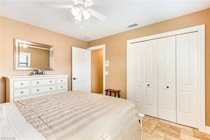 Neutral-toned walls complement the textured tile flooring - Virtually Edited Image