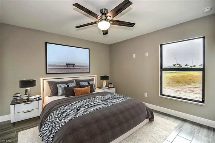 Bedroom featuring hardwood / wood-style flooring and ceiling fan