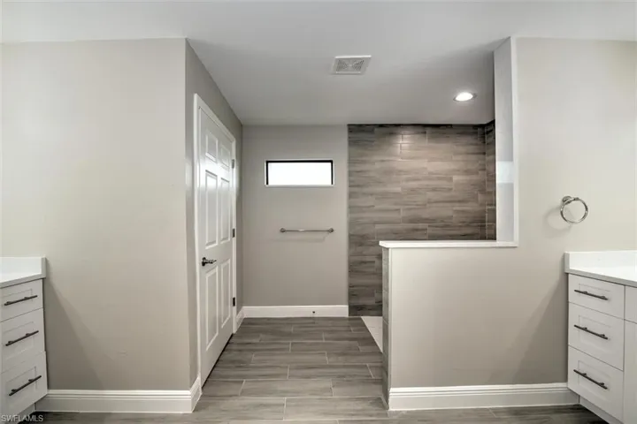 Bathroom featuring vanity and tile patterned flooring