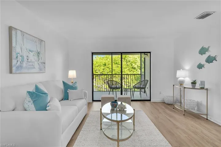 Living room featuring wood finished floors and baseboards