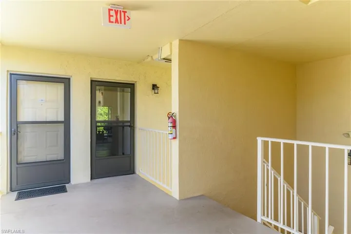 Property entrance with stucco siding
