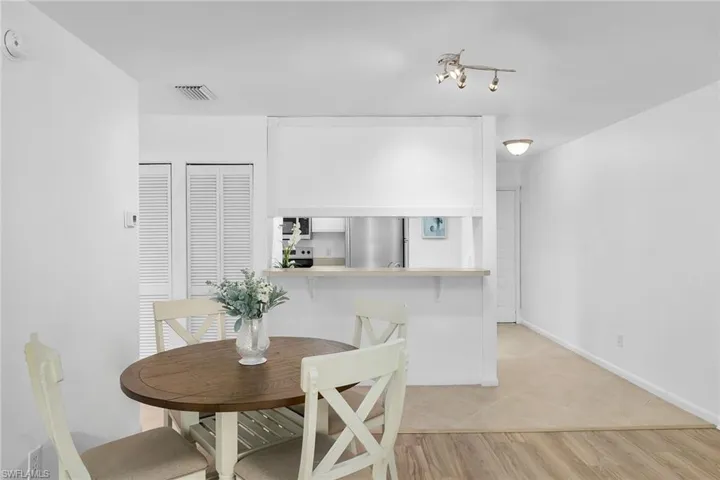 Dining area with light wood-style floors