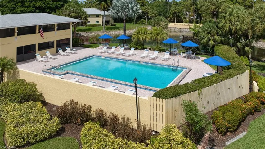 Rectangular swimming pool with a tile border and paver surround