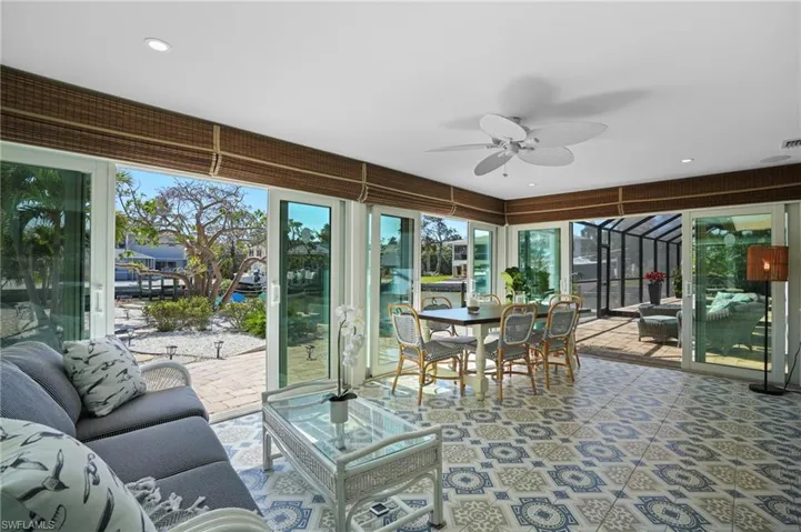 Sunroom / solarium featuring a ceiling fan. Virtually Edited Image