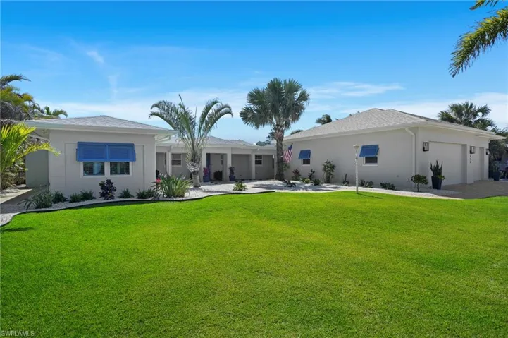 Front view of house with an attached garage, stucco siding, and a front yard, Virtually Edited Image