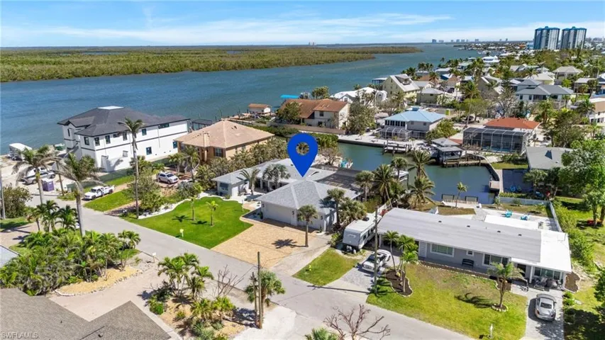 Birds eye view of property featuring a water view and a residential view - Virtually Edited Image