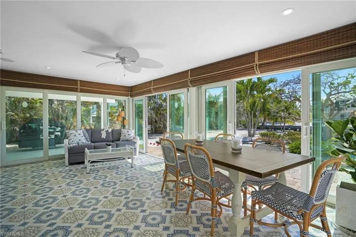 Sunroom with ceiling fan. Virtually Edited Image