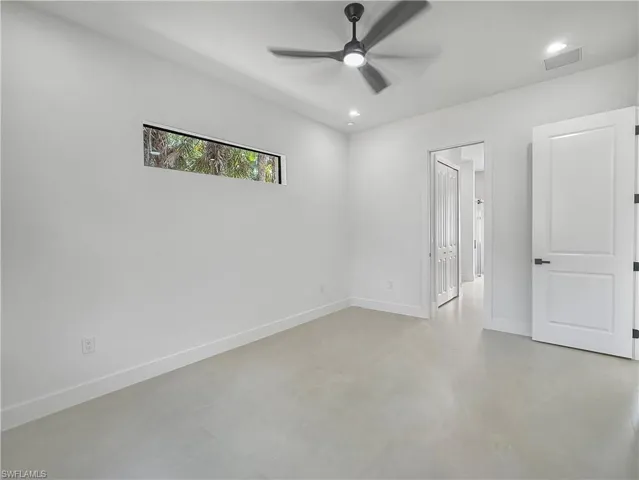 Unfurnished bedroom with a ceiling fan, finished concrete floors, recessed lighting, and a closet