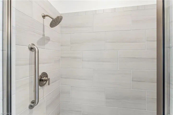 Bathroom view of a tile shower