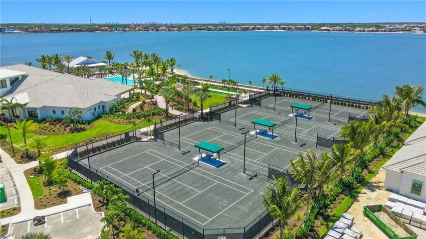Drone / aerial view of a large body of water and a pool