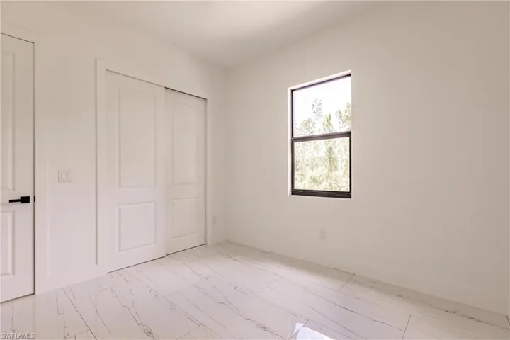 Unfurnished bedroom featuring a closet