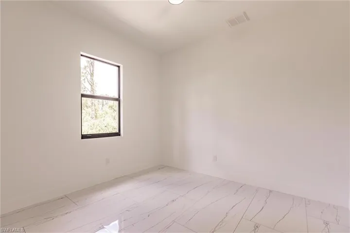 Unfurnished room with tile flooring