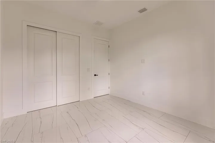 Unfurnished bedroom with a closet