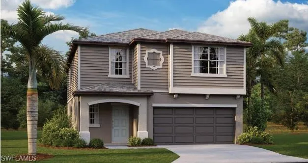 View of front of house featuring a garage and a front lawn