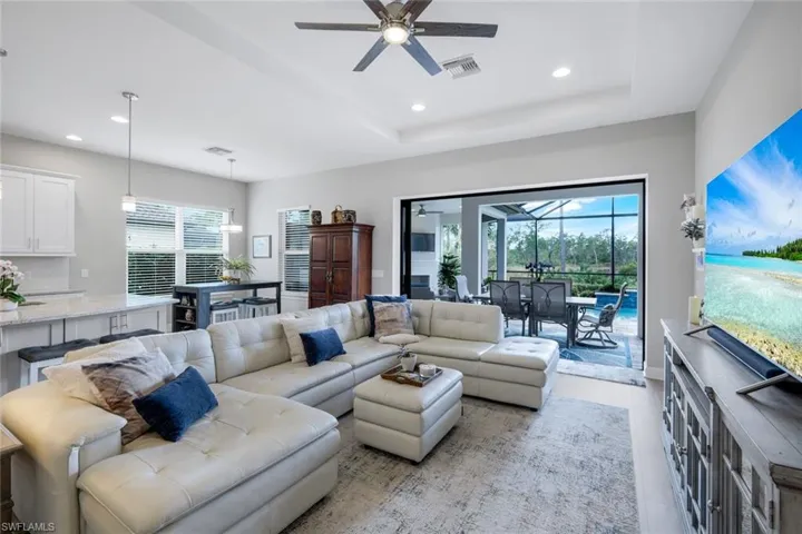 Open Living area with panoramic sliding doors that open fully leading onto the lanai
