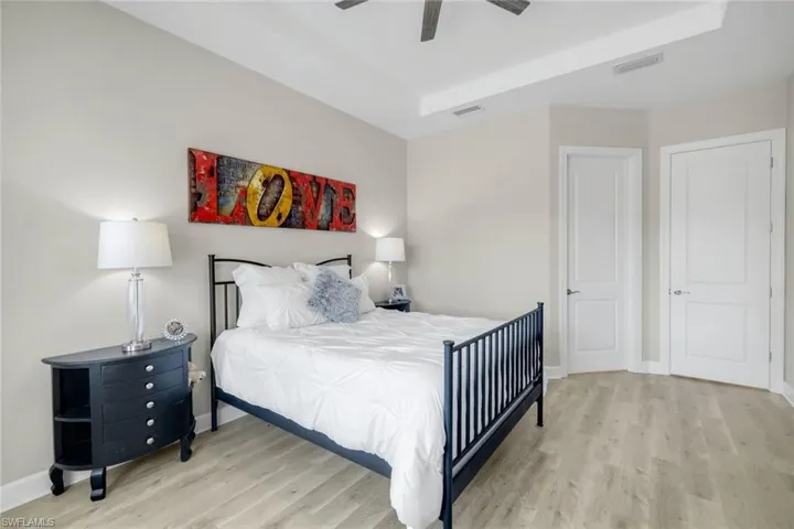 Bedroom with light wood-style flooring and ceiling fan