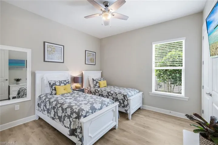 Bedroom with light wood-style flooring and ceiling fan